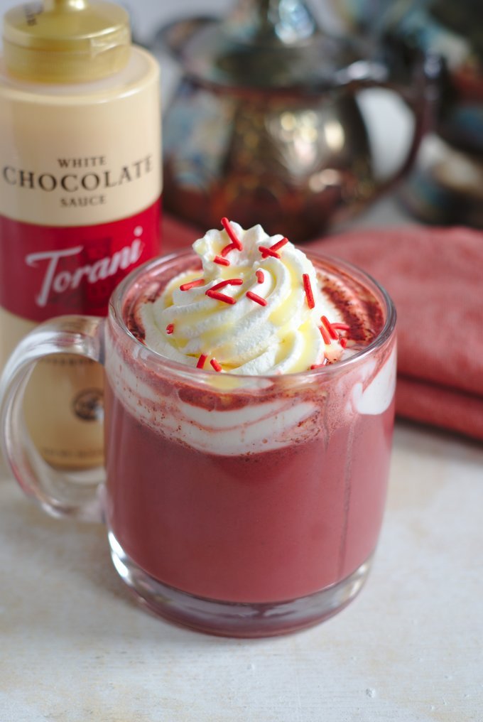 Rich, velvety, and boozy, this cocktail is made with red velvet hot chocolate and spiked with your choice of liquor. A dreamy addition to your Christmas-themed cocktails.