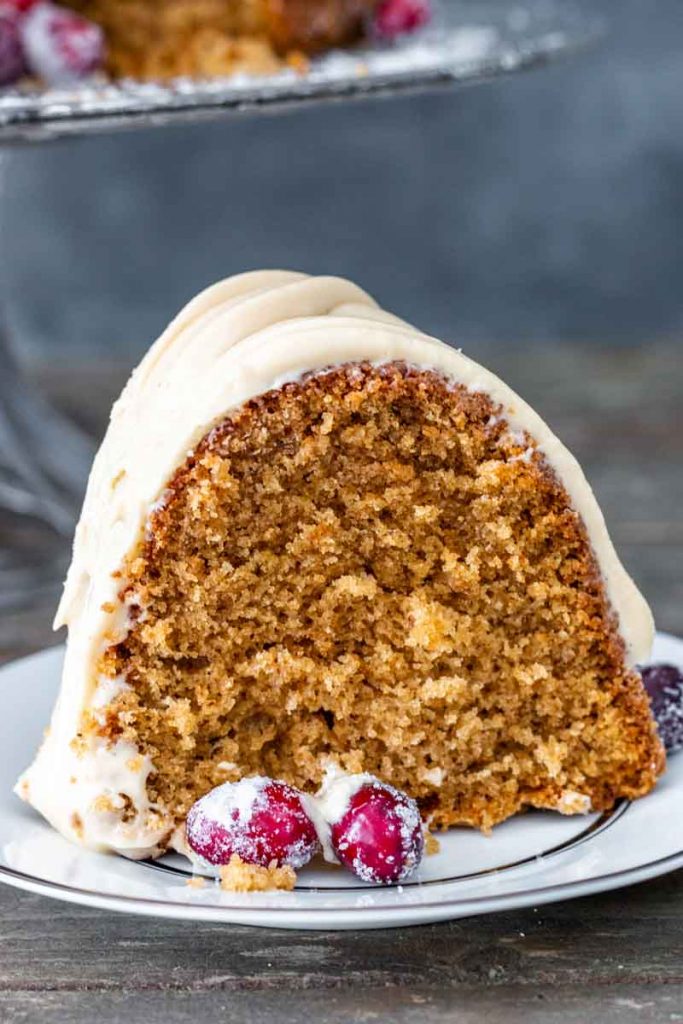 Close up view of brown sugar spice cake on a white plate