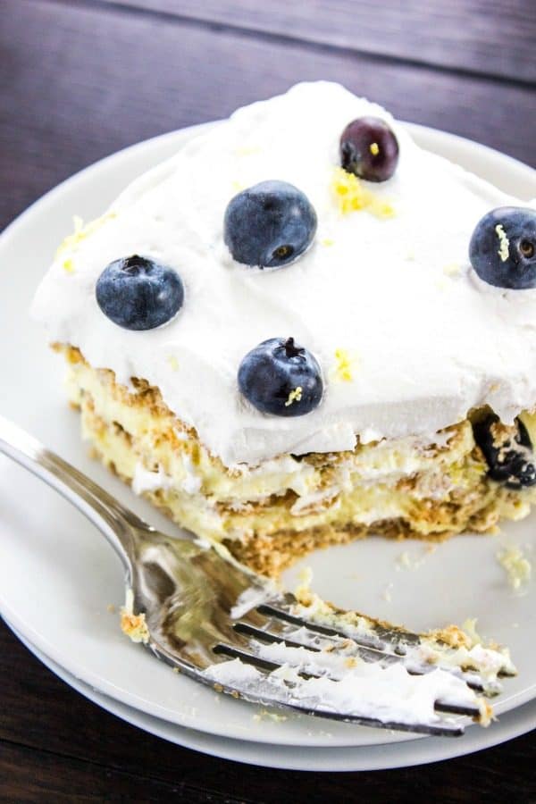 Zesty lemon and sweet blueberries come together in this refreshing Lemon Blueberry Icebox Cake. With layers of graham crackers, creamy lemon filling, and fresh blueberries, it’s a bright and tangy dessert that’s perfect for summer—especially when it’s too hot to turn on the oven!