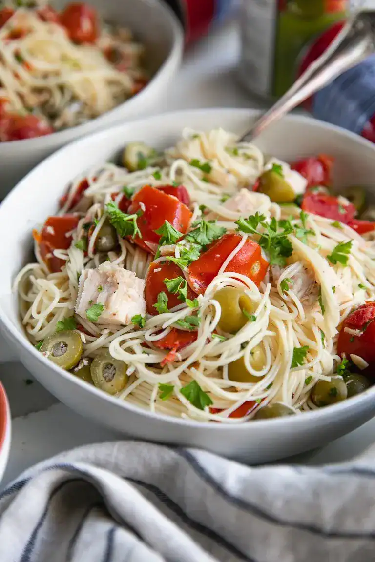 This 15-minute angel hair pasta with chicken is one of those lifesaver dinners for busy nights. Made with canned chicken, vine-ripened tomatoes, and green olives, it comes together fast without skimping on flavor. Even picky eaters tend to love it, and using pantry staples means less waste, less prep, and more time off your feet — always a win.