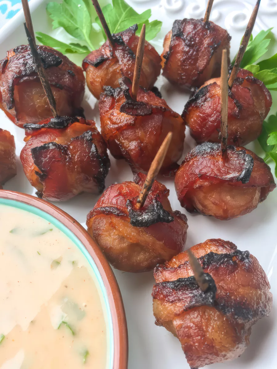 This tasty little appetizer is reminiscent of the classic Rumaki, minus the chicken livers and brown sugar. In this version, honey provides a touch of sweetness, while a spicy mustard dip adds some heat. Together, they create a winning combination that will soon become a new family favorite!