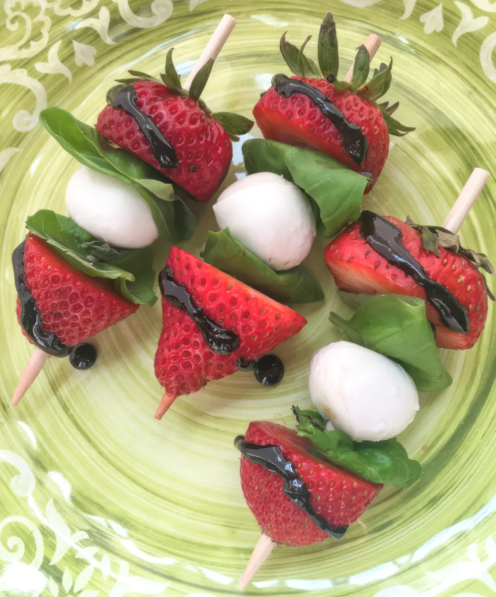 This quick and easy appetizer is sure to be a hit at your next party. This fun variation of the traditional Caprese salad replaces the classic tomato with sweet strawberries, which pair beautifully with the rich balsamic glaze and fresh basil.