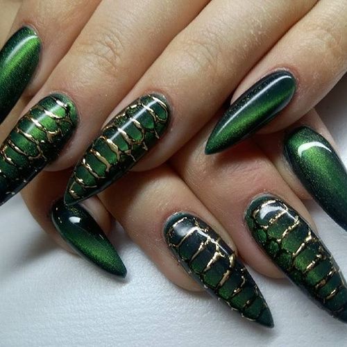 This nail art design features an elegant snake skin pattern with shimmering green and gold accents, creating a luxurious and sophisticated look. The metallic finish highlights the intricate scale details, perfect for adding a touch of glamour and mystery to any style.