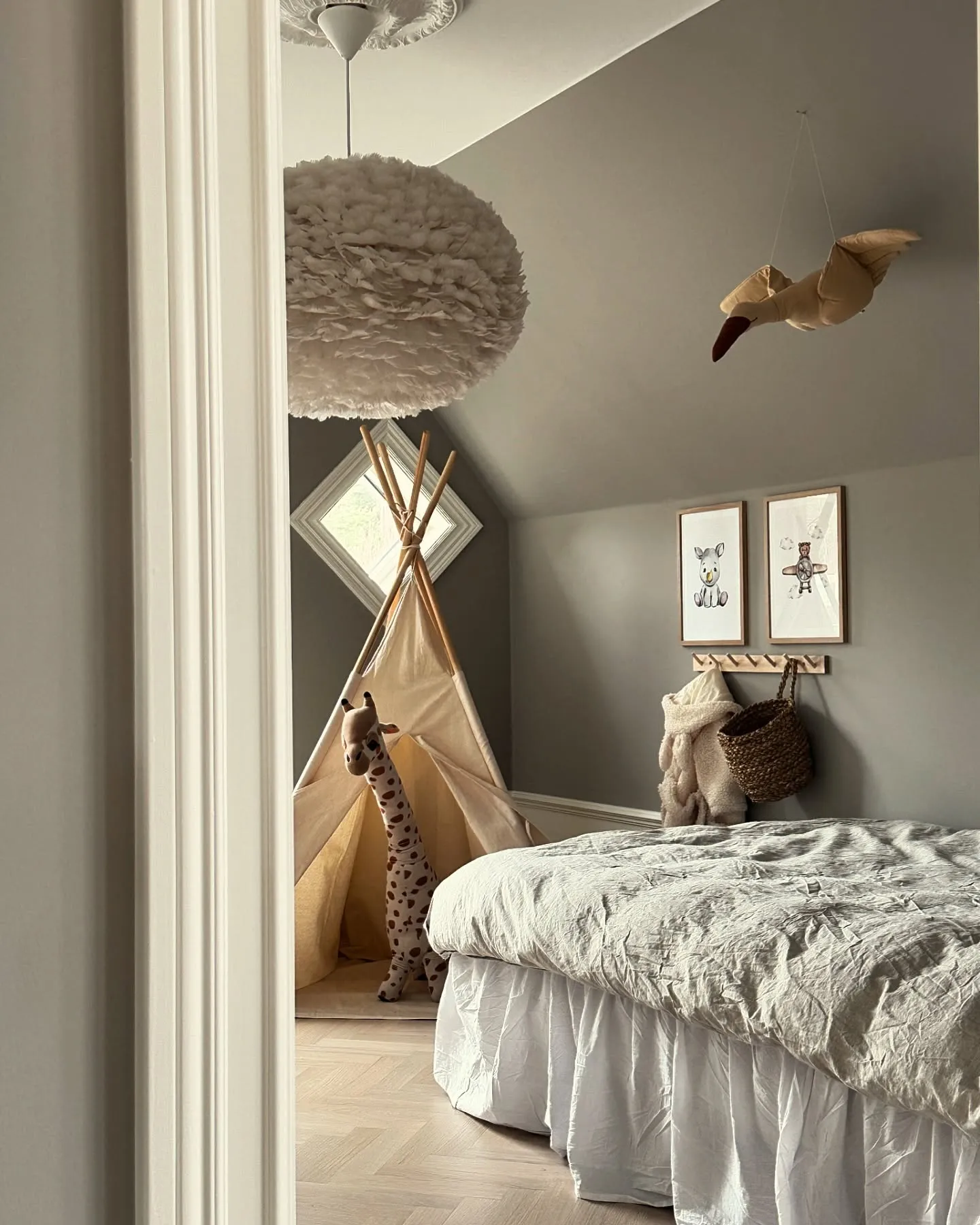 Playful Teepee RetreatA neutral palette pairs beautifully with natural light in this attic space. The addition of a teepee creates a fun hideaway for imaginative play, while the soft textures of the bedding and rug balance the minimal decor.