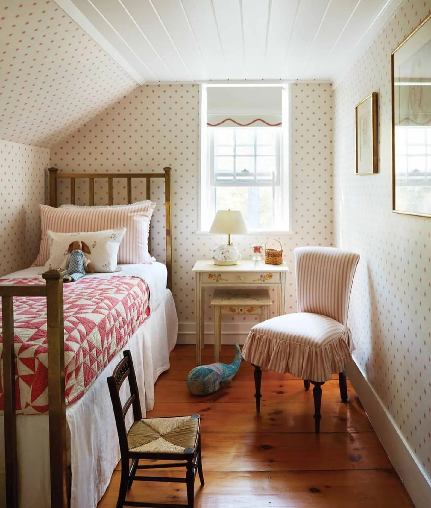 Cozy Vintage CharmThis attic room makes the most of its sloped ceiling with a low bed positioned along the wall. The vintage-inspired quilt, soft lighting, and warm wooden floors create a cozy and nostalgic vibe, perfect for a child who loves timeless comfort.