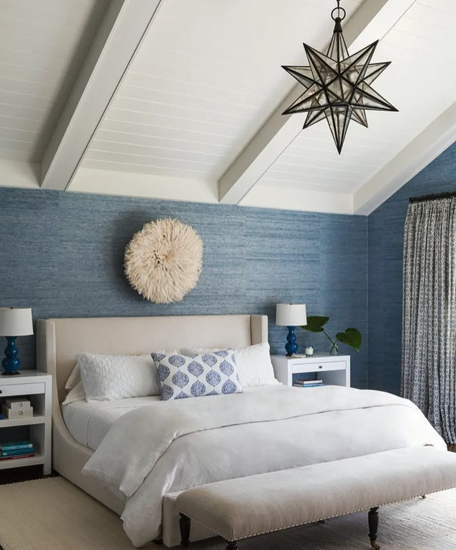 "Crisp Coastal Vibes" – Blue walls and soft white accents give this bedroom a fresh, breezy feel. The statement light fixture adds a touch of personality.