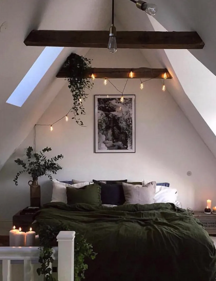 "Romantic Retreat" – String lights and natural wood beams make this space cozy and magical. A mix of greenery and soft textures completes the look.