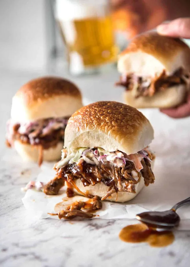 Throw in a pork shoulder, your favorite spices, and let the slow cooker do its thing. Come dinnertime, all you need are buns and a little barbecue sauce. Hello, happiness!