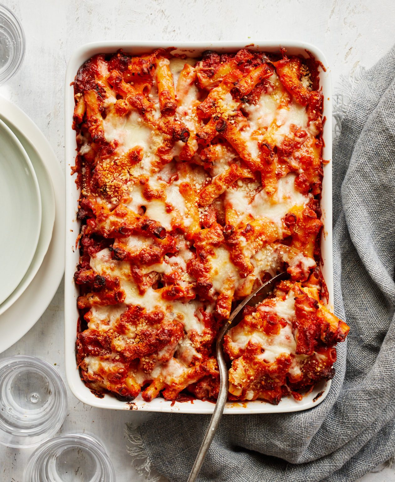 Baked Ziti: Gooey layers of pasta, marinara, and melted cheese. Make it ahead and pop it in the oven when you’re ready.