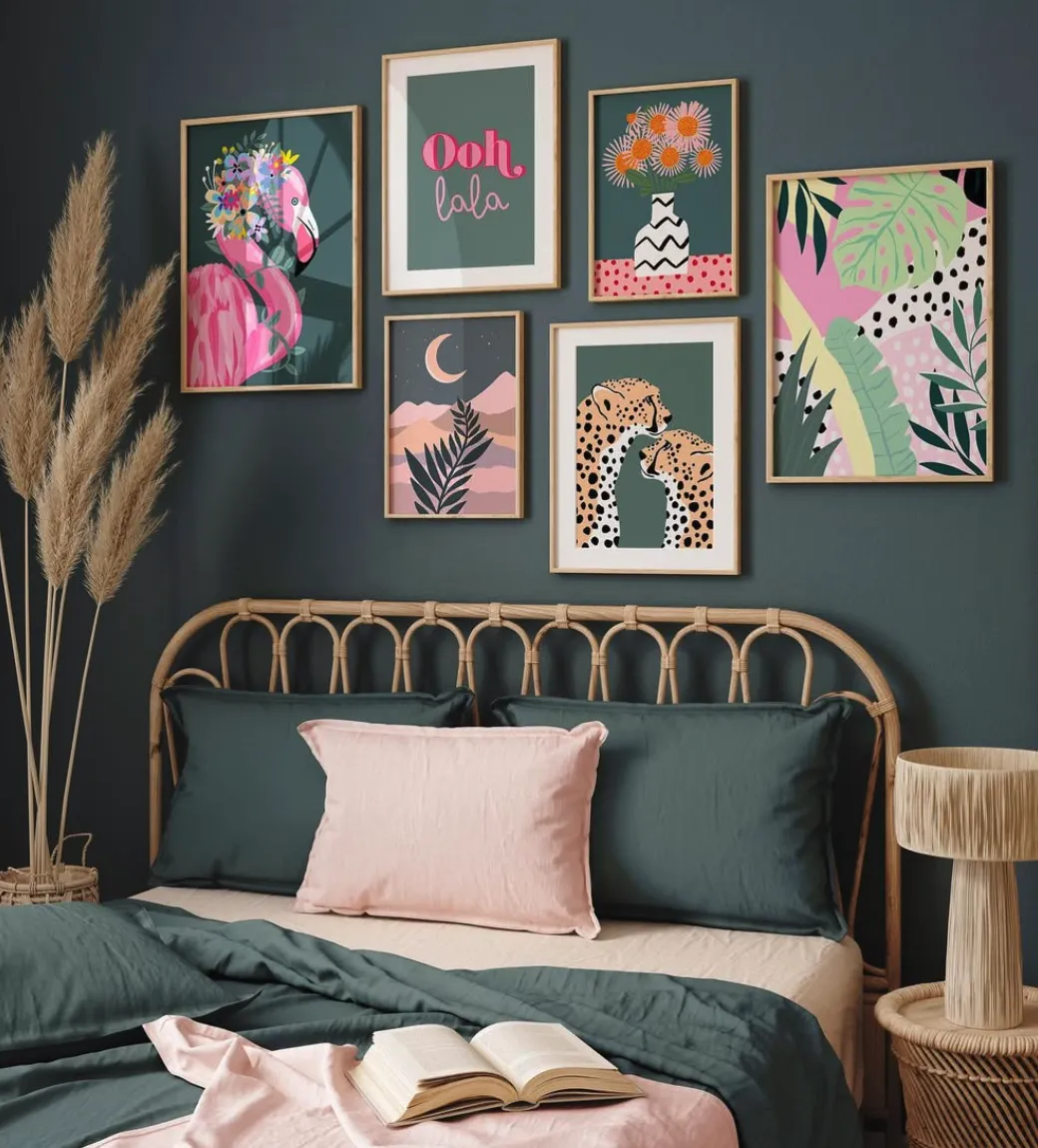 Vibrant and Eclectic Gallery WallThis bedroom features a colorful gallery wall that makes a bold statement against the deep green backdrop. Playful flamingos, tropical leaves, and cheerful typography are combined in mismatched frames, creating a lively yet cohesive display. The rattan headboard adds a natural touch, complementing the art's tropical vibe. Soft pink and dark green bedding ties everything together for a cheerful, inviting space. This setup is perfect for someone who loves bold patterns and tropical inspirations.