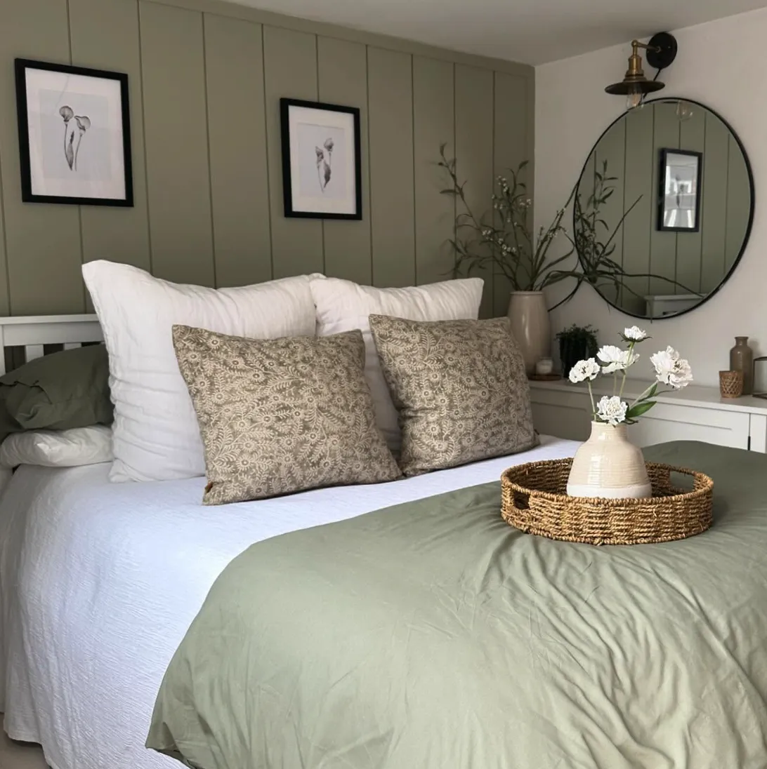 Classic Board and Batten WarmthThis cozy bedroom showcases a traditional board and batten wall in olive green, creating a sense of timeless comfort. The framing detail adds architectural interest and pairs beautifully with soft lighting and textured bedding. Board and batten is beginner-friendly for DIYers with access to a saw and a nail gun. You can complete the project in two days: one for construction and one for painting. It’s an excellent way to add warmth and sophistication without breaking the bank.