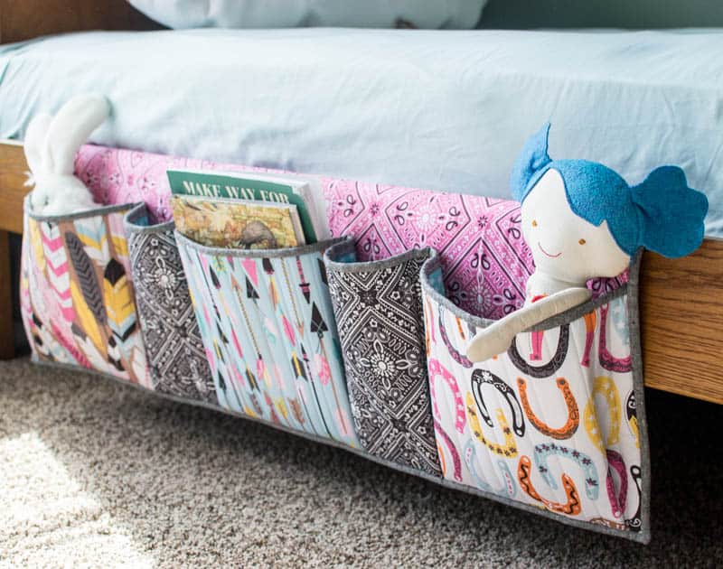 GENIUS idea for adding storage pockets to your bed! This would work great on kid