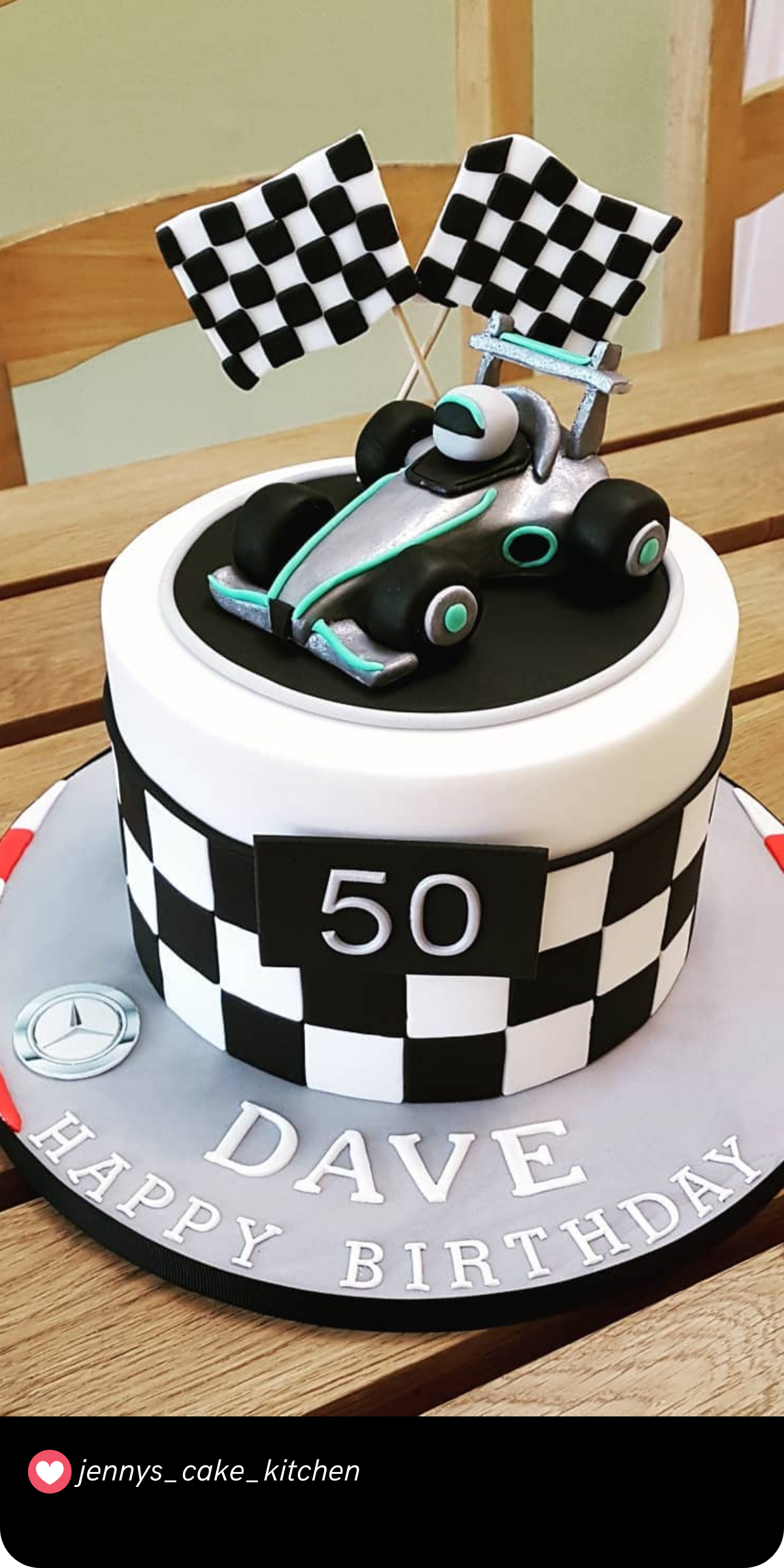 Start your engines for this sleek Formula 1-inspired cake! The checkered flag pattern and a realistic race car on top make it perfect for fans of fast cars and high-speed excitement. It’s ideal for a milestone birthday like turning 50!