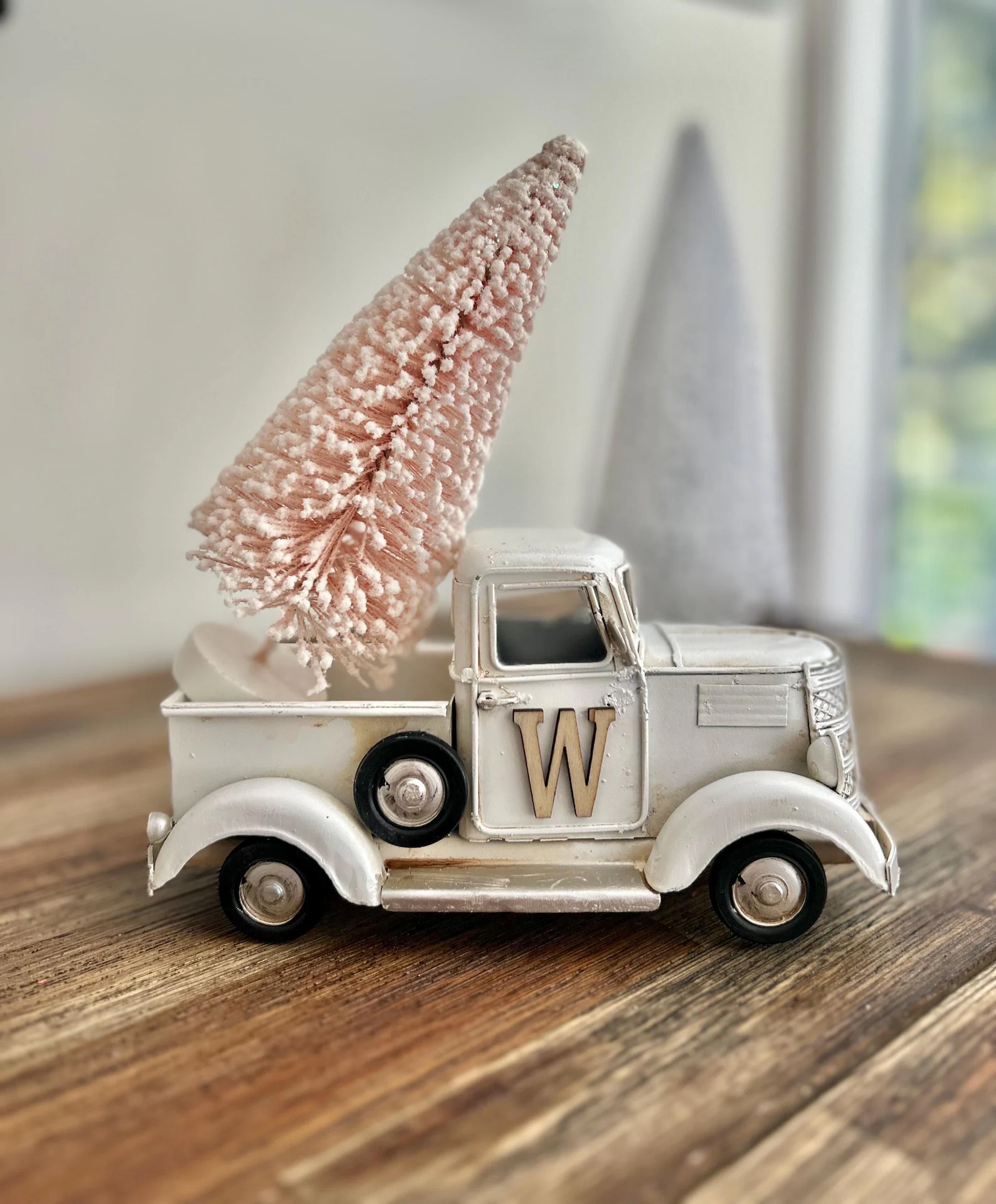 How cute is this little vintage truck? The soft blush bottle-brush tree in the back adds the dreamiest touch of boho Christmas charm. Each truck has its own rustic personality thanks to the hand-distressed finish, making it feel like a true one-of-a-kind treasure. Perfect for styling on your mantel or shelf, it brings a sweet mix of farmhouse nostalgia and soft, modern elegance to your holiday setup.
