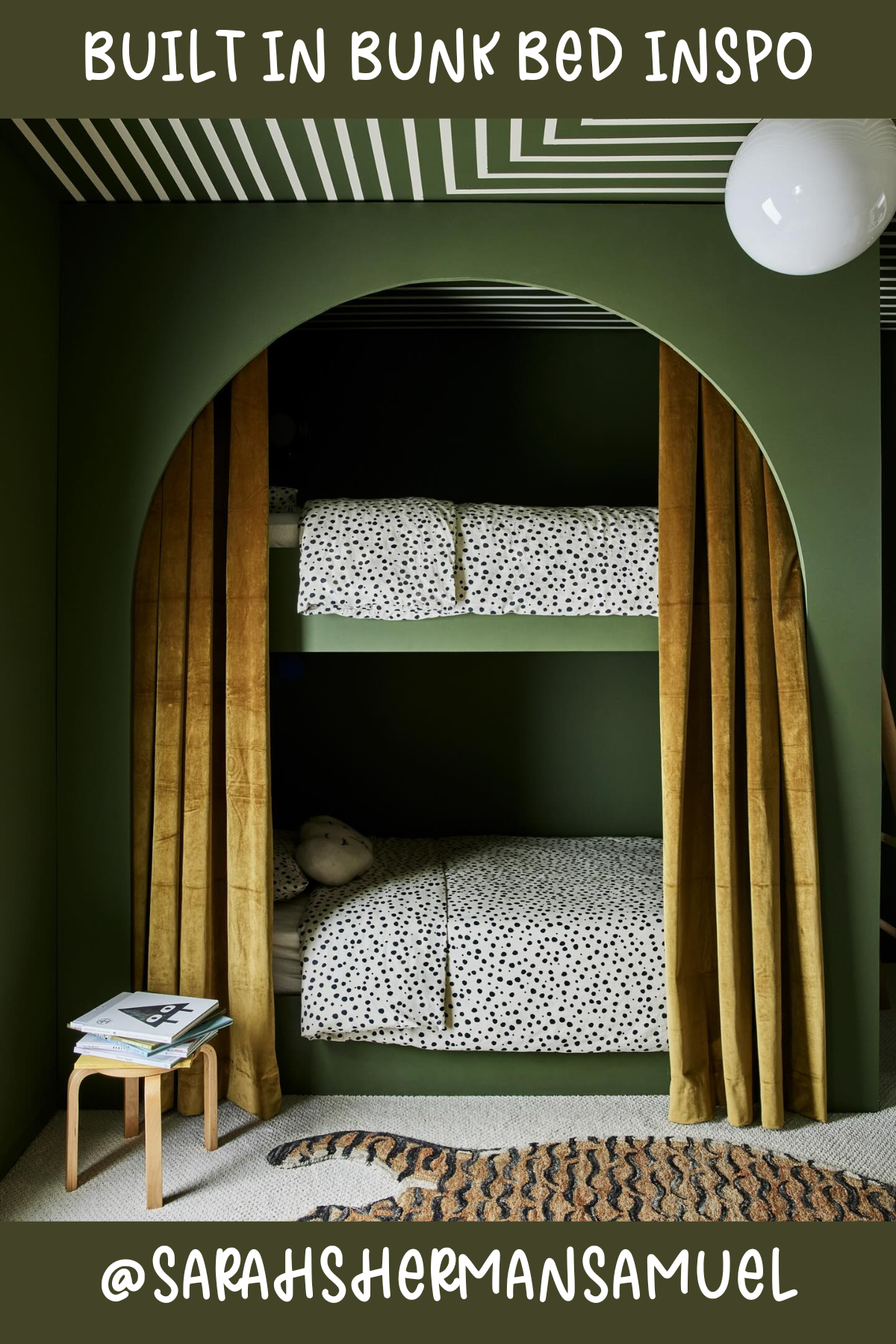 Cozy and moody, this bunk setup features rich forest green walls and a stunning arched entry. The mustard velvet curtains give it a dramatic and luxurious touch, creating a secret nook for bedtime stories and late-night giggles. The spotted bedding adds a playful pattern without overpowering the serene vibe. So chic!