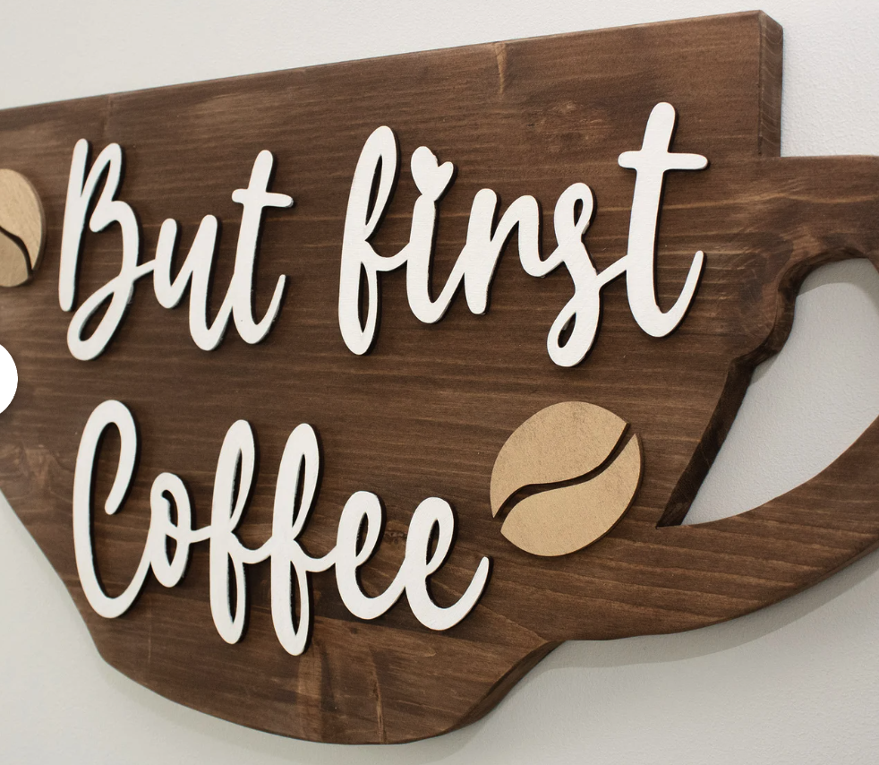 Think framed coffee-themed prints, a “But First, Coffee” sign, or even a coffee bar organizer for their brewing station. It’s a gift that’s both practical and Pinterest-worthy.