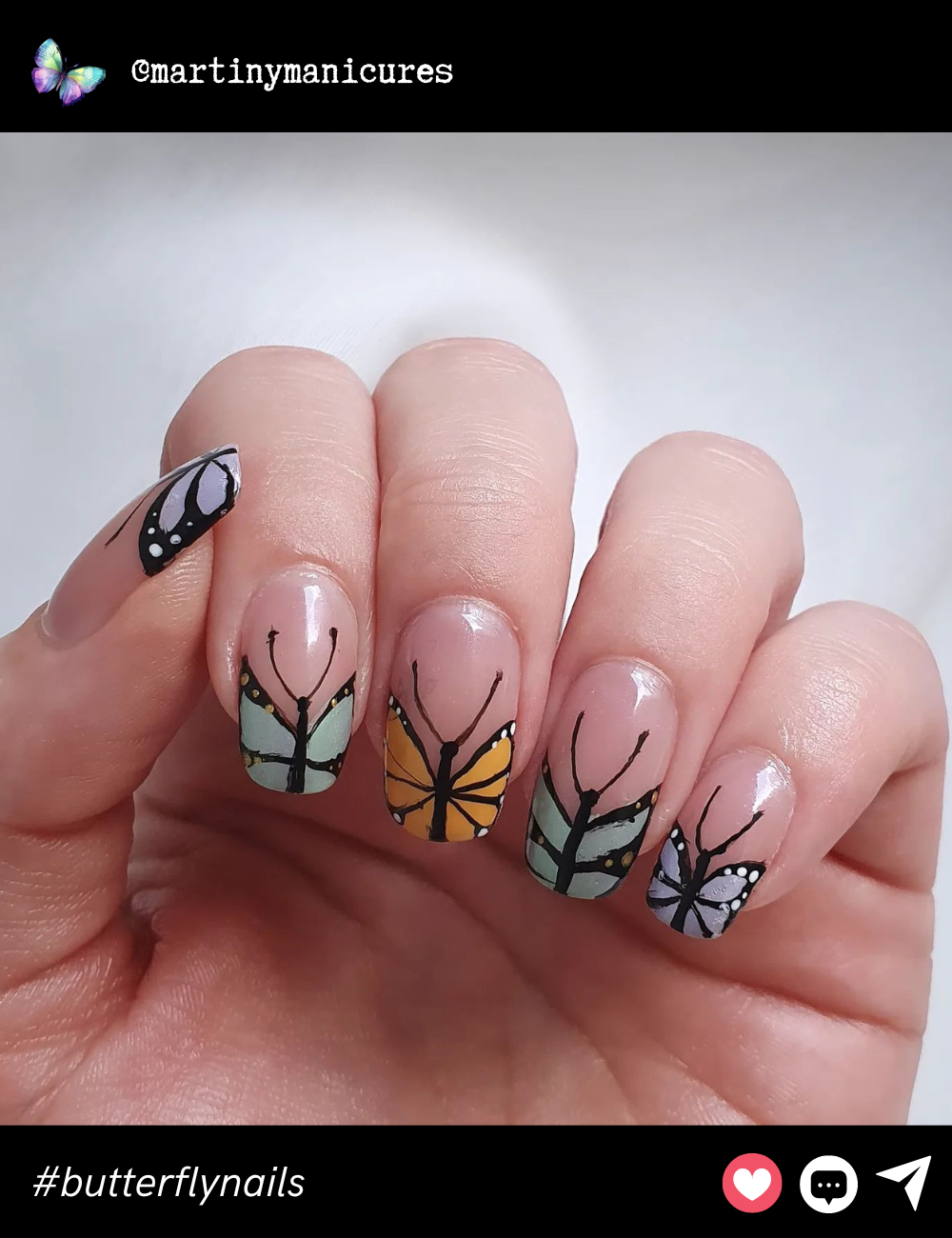 This playful design splits each nail into individual butterfly wings, creating a unique, cohesive look with pastel tones that pop against the clear base.