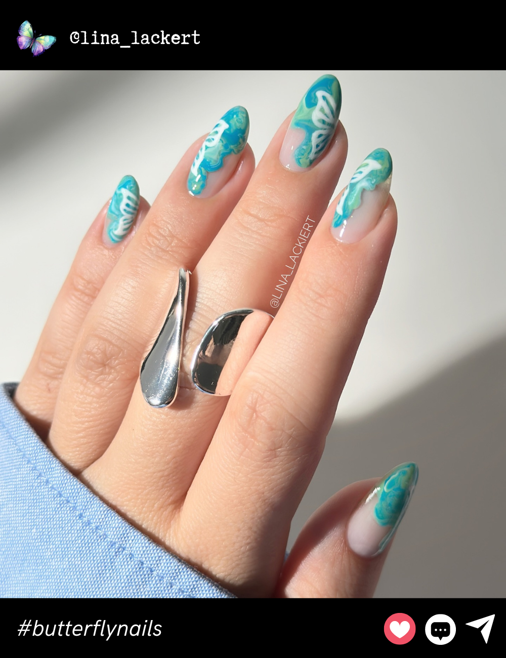 These dreamy turquoise marbled butterfly nails offer a soft, ethereal vibe with their fluid, watercolor-like design.