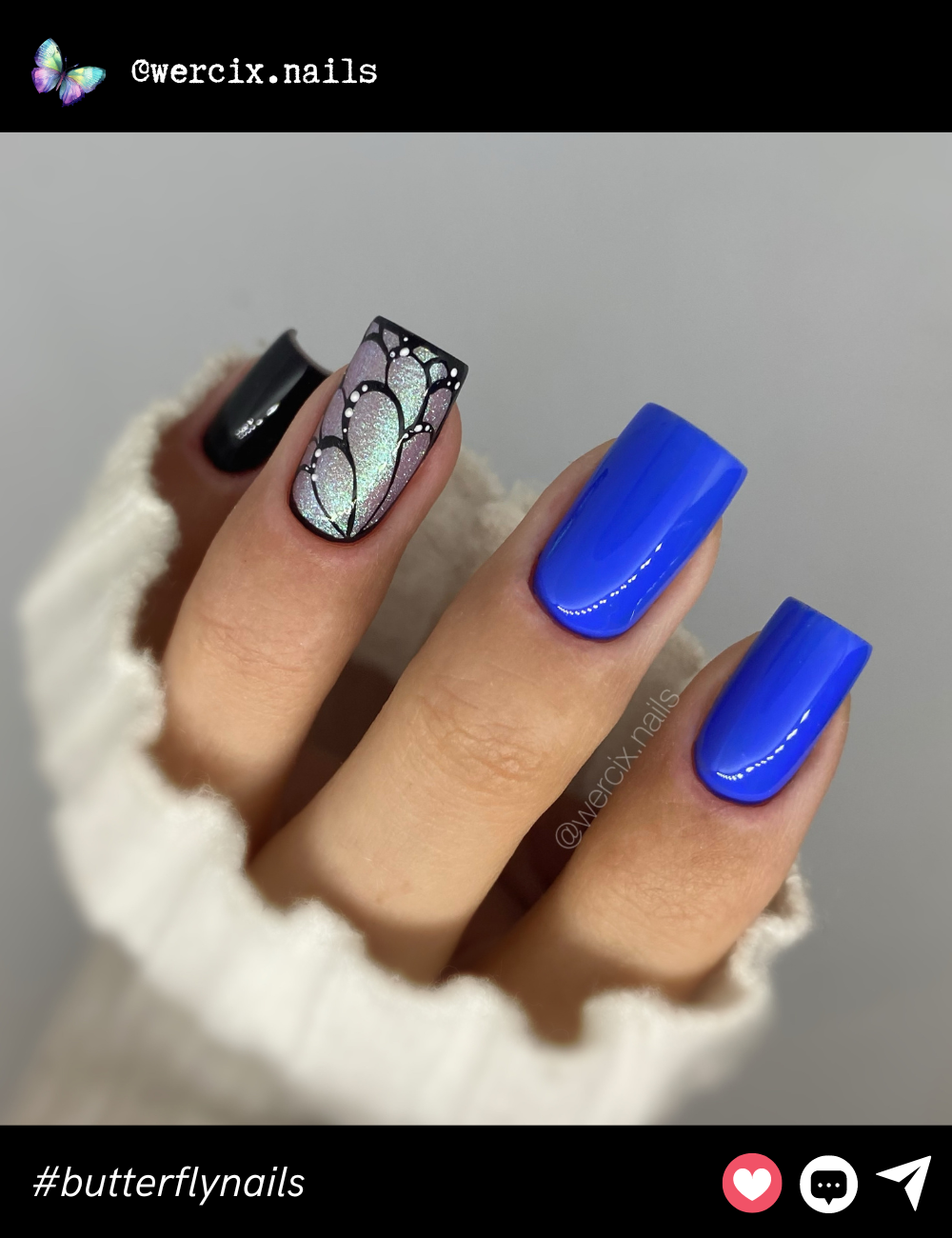 A shimmering lavender butterfly wing accent nail paired with bold cobalt blue and black nails for an eye-catching mix of softness and intensity.