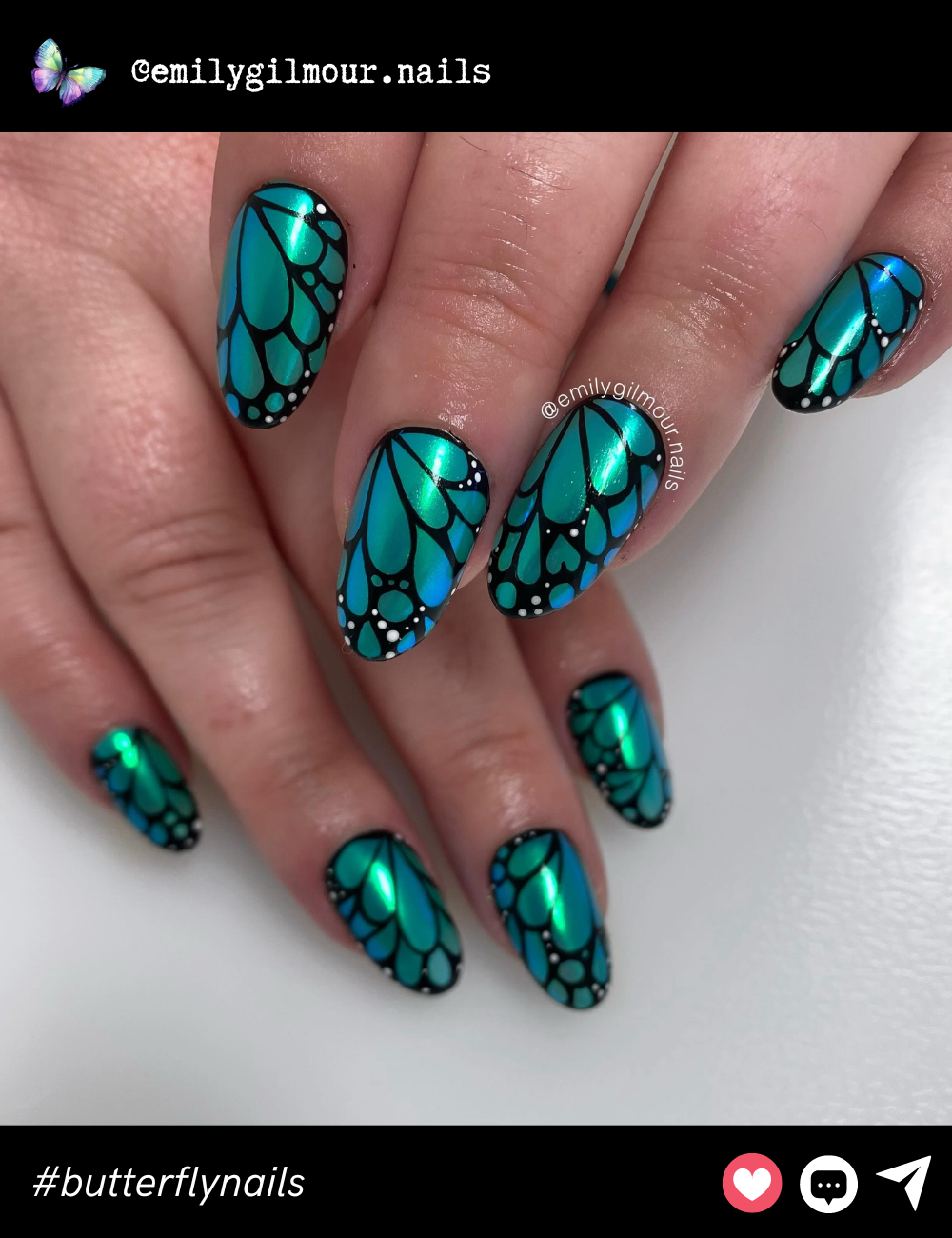 Stunning teal and green iridescent butterfly wings with black accents make for a bold and striking statement manicure.