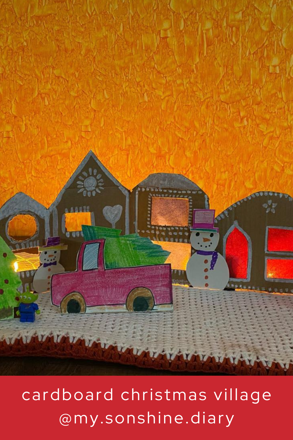 Add a pop of color to your Christmas village with this playful display! Featuring vibrant cardboard houses, a snowman, and even a little Christmas truck, this craft lets your imagination run wild.