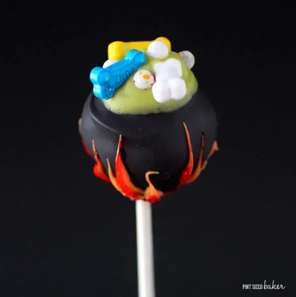 Cauldron Cake Pops – These bubbling witch cauldron cake pops are decorated with candy flames and spooky ingredients, ready to stir up some Halloween magic.