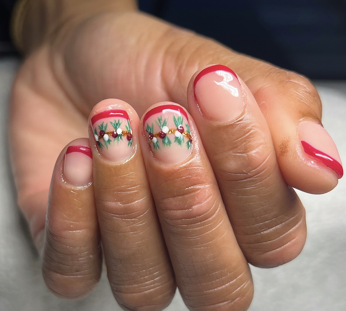 French Twist with Garland: A modern take on the classic French manicure, with red tips and festive garland details on accent nails. This fresh, unique design is great for those who want a festive but refined look. @__killernailz