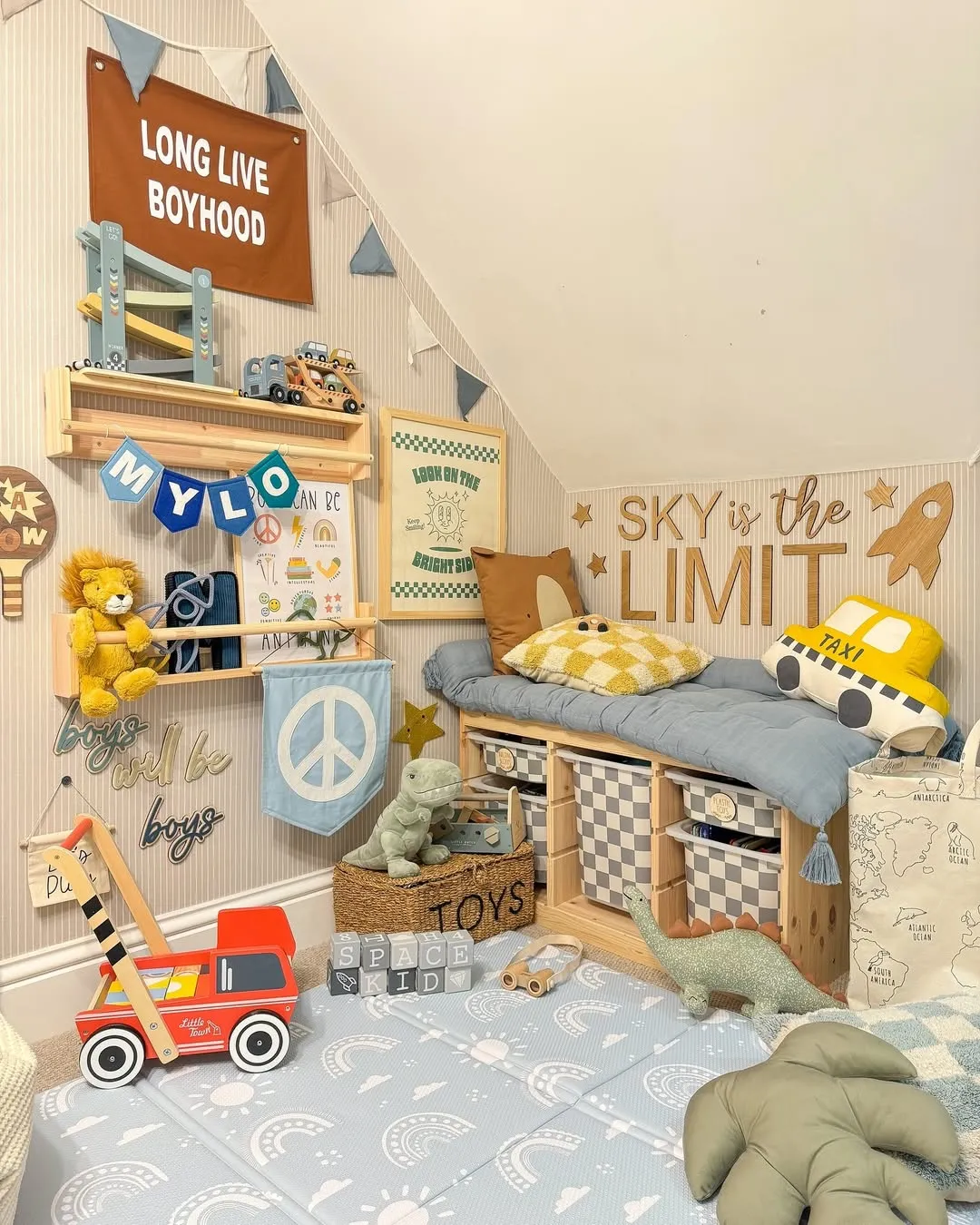 "Sky’s the Limit" – This under-the-eaves playroom is packed with personality! From the rocket theme to cozy storage benches, it’s a perfect spot for little dreamers to explore and play.