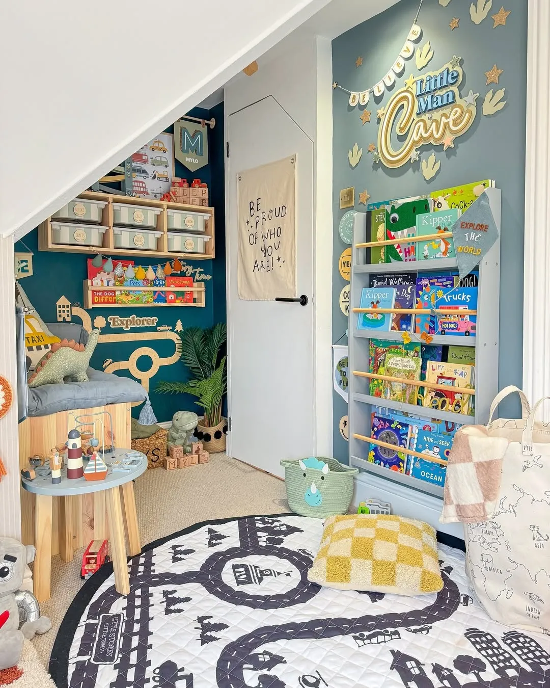 "A Reading Nook with Charm" – This under-stairs playroom is packed with character! The library-style book display and personalized touches make it the ultimate kid-approved hideaway.