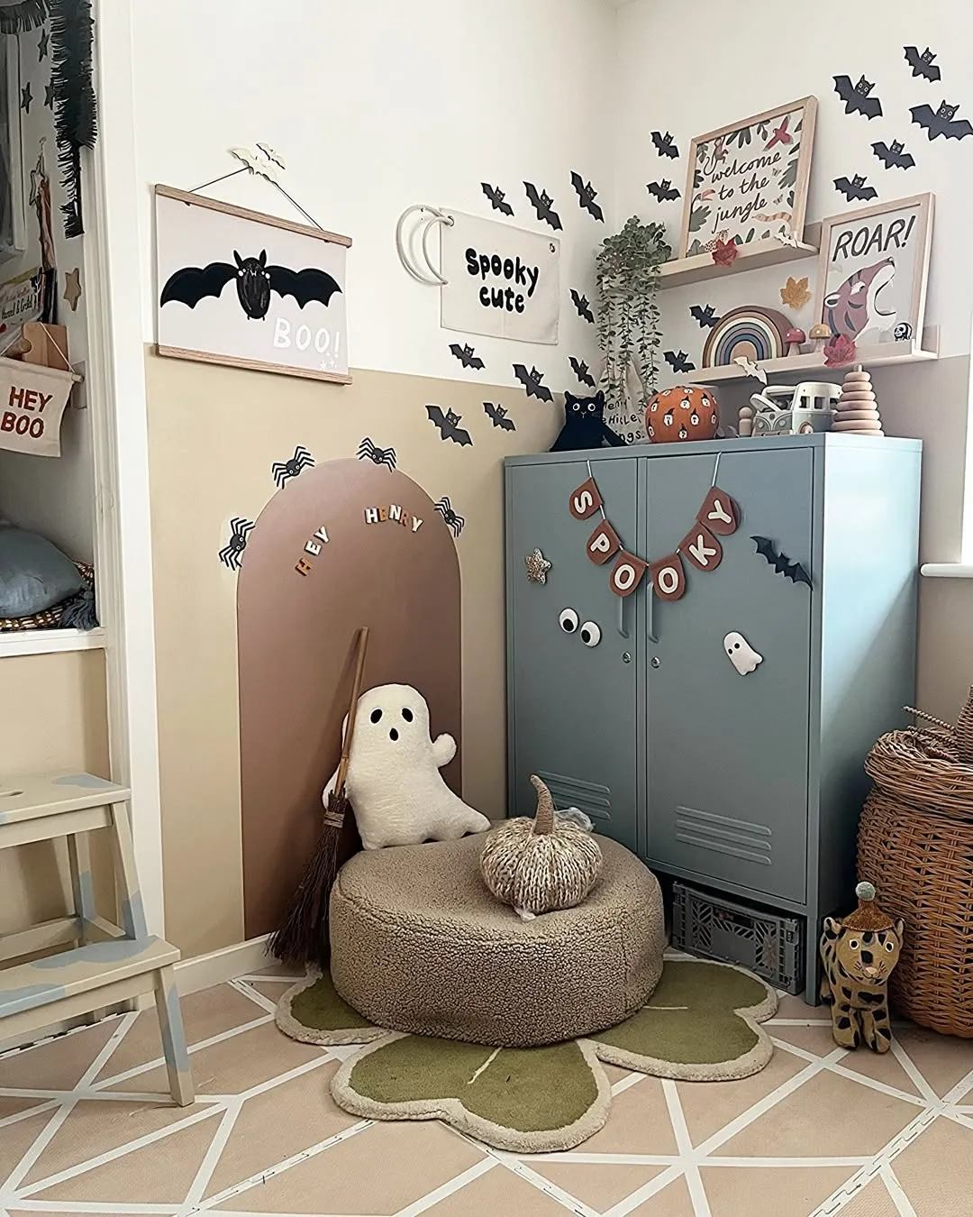 "Spooky and Sweet" – A cozy Halloween-themed play area with bat decor and soft textures that can be switched out for different seasons. Functional and festive!