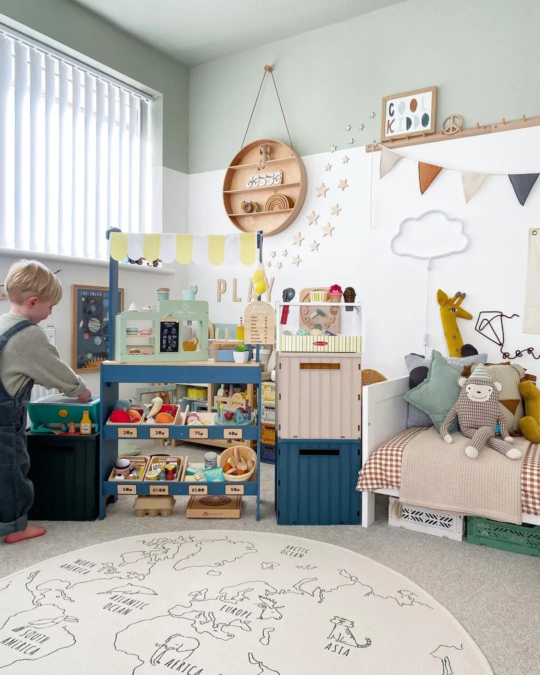 "Global Explorers" – A play market setup paired with a world map rug! This playroom sparks both creativity and curiosity about the world—so adorable and educational.