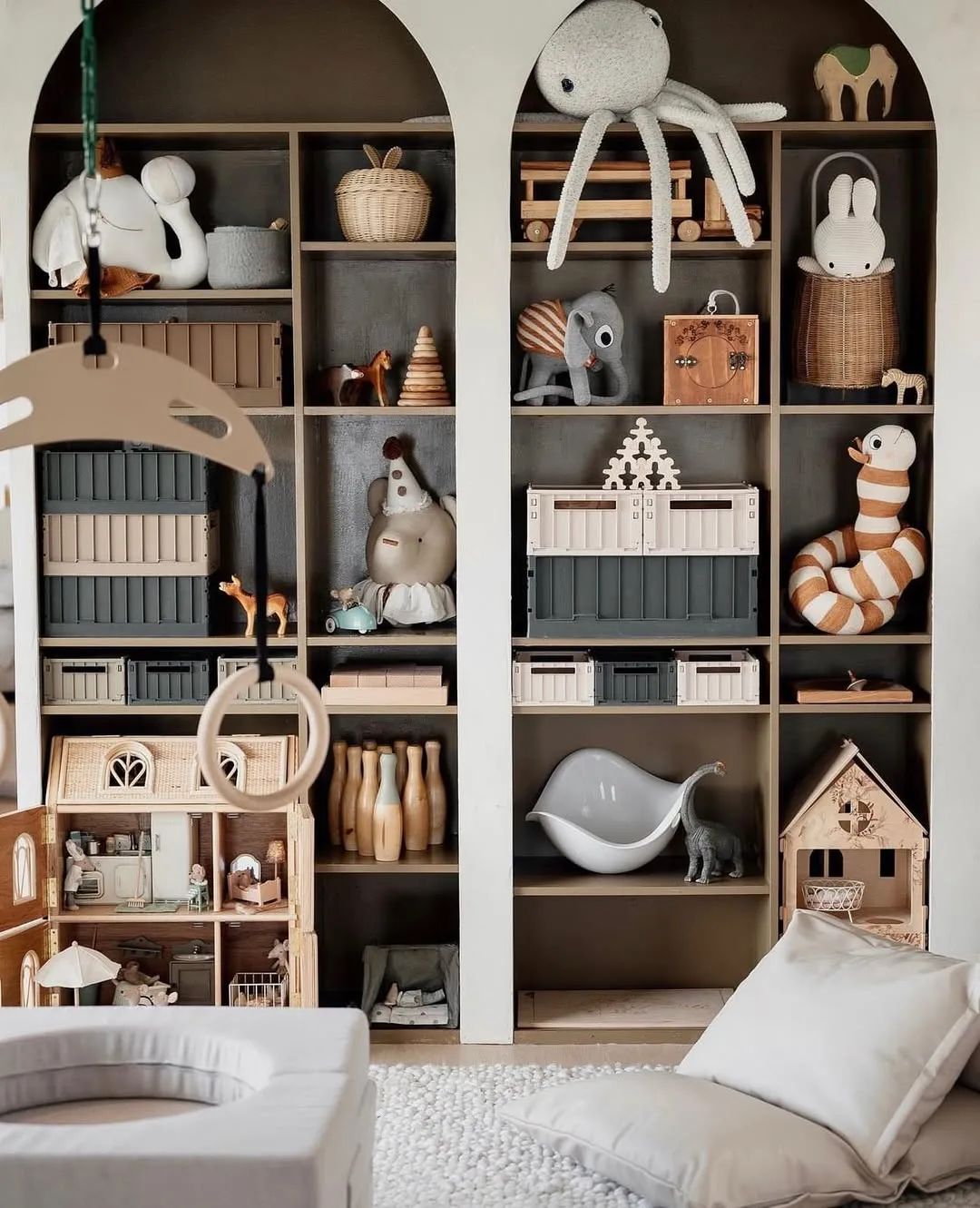 "Whimsical Wonder" – Arched shelves add a magical vibe while showcasing plush toys and wooden treasures. The color-coordinated bins keep the chaos at bay!