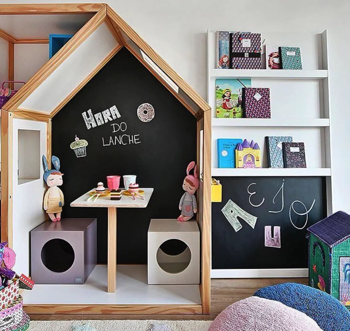 House of Creativity – This adorable playhouse with a chalkboard wall transforms into a cozy café or creative hub. Perfect for drawing, writing, and fueling imaginative play with its doll-friendly table setup.