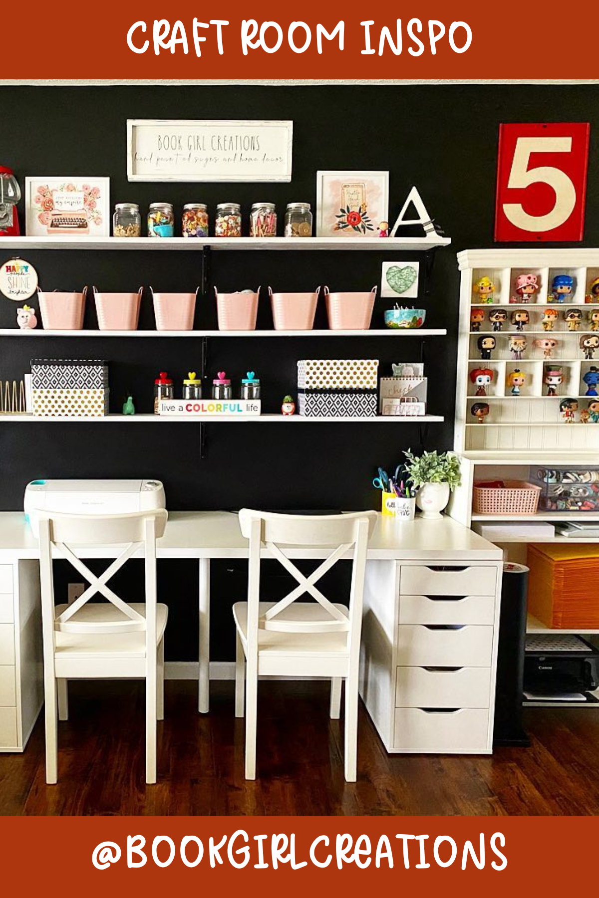 @bookgirlcreations – Moody and stylish! The bold black wall provides a chic backdrop for the shelving filled with crafting supplies. Dual desks mean this room is ready for collaborative creativity, and the touches of pink keep it fun and bright.