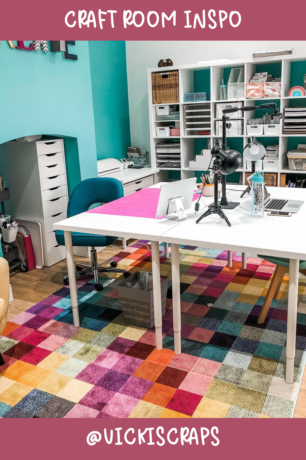 @vickiscraps – Bright, bold, and ready for action! This room's standout feature is that vibrant patchwork rug, adding a splash of color to the clean white furniture. Plenty of storage and a large worktable make it ideal for any project!