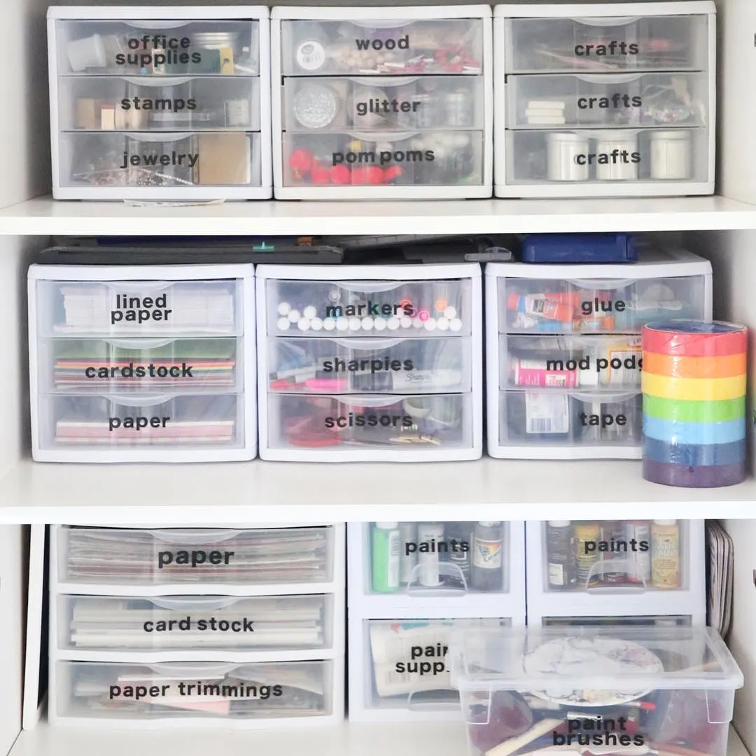 Clear, labeled plastic drawers are a game-changer for keeping everything from glue to scissors in check—quick to grab and easy to maintain!