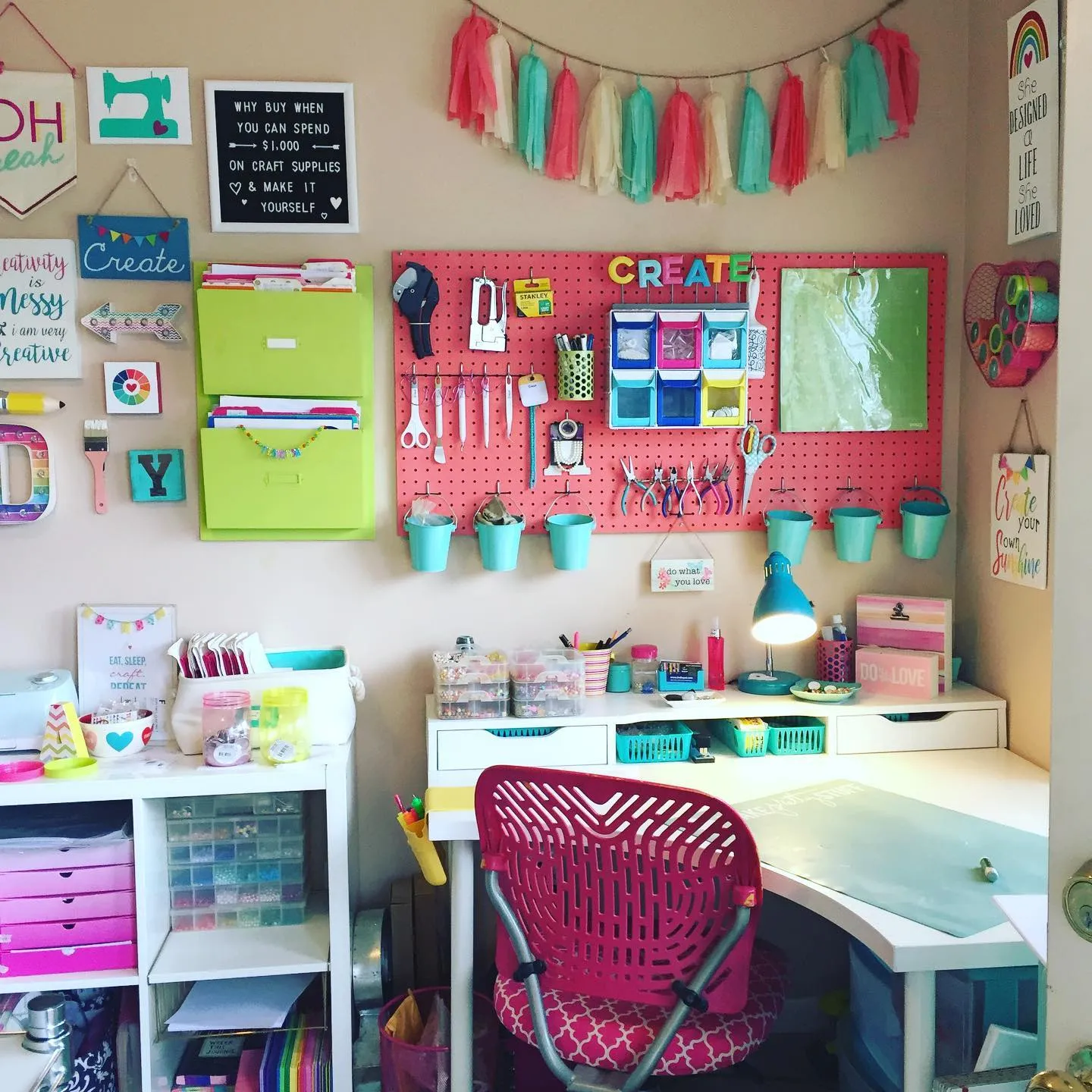 Bright and playful! A colorful pegboard with hanging bins, hooks, and shelves turns an empty wall into a beautifully organized craft corner.