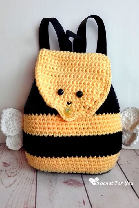 Check out this adorable Bumble Bee Backpack, designed for kids to tote around their own things! With its charming bumble bee face on the flap, snazzy yellow and black stripes all over, and even tiny wings, this backpack is buzzing with cuteness! This free crochet pattern is easy to follow - even for beginners and your little one will love to wear it. Don't miss out on the bumble bee backpack trend!