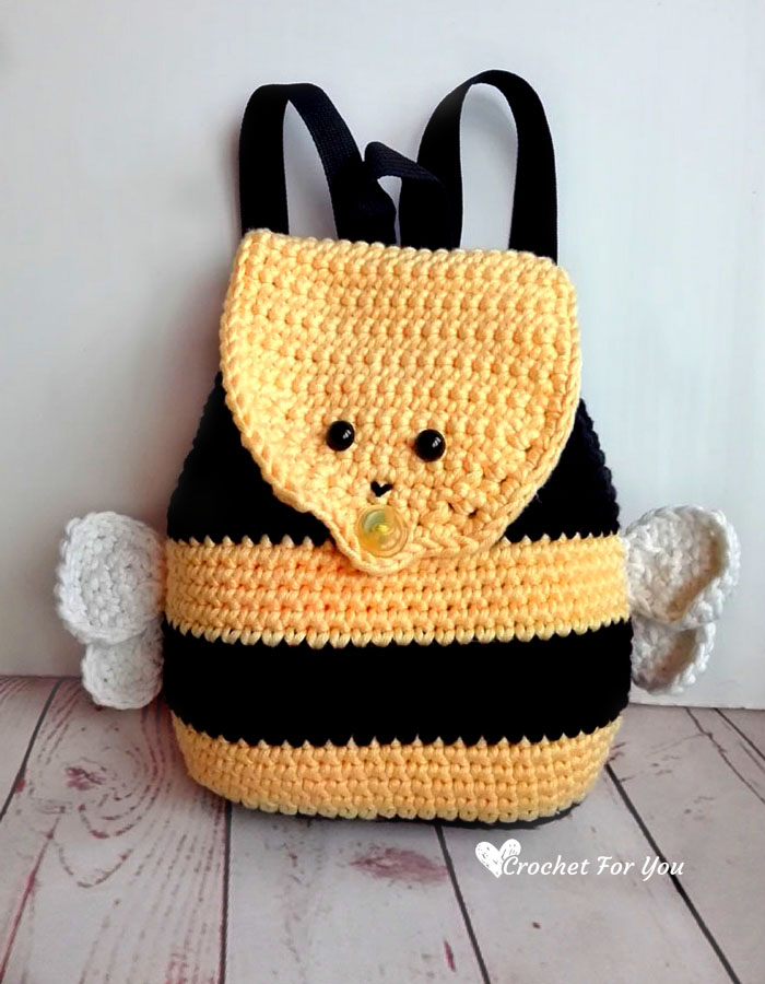 Check out this adorable Bumble Bee Backpack, designed for kids to tote around their own things! With its charming bumble bee face on the flap, snazzy yellow and black stripes all over, and even tiny wings, this backpack is buzzing with cuteness! This free crochet pattern is easy to follow - even for beginners and your little one will love to wear it. Don't miss out on the bumble bee backpack trend!