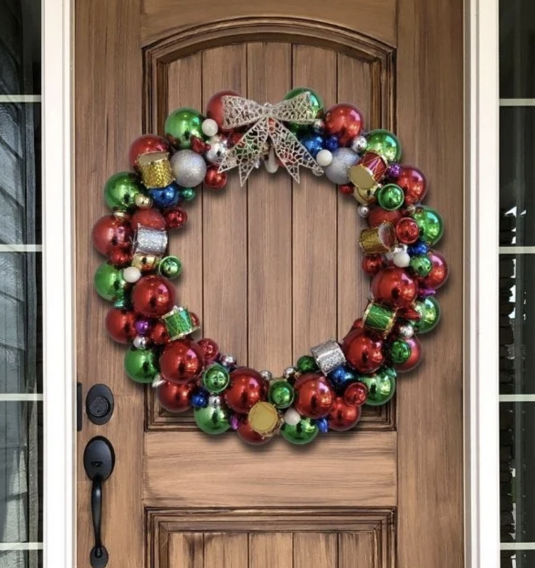 This vibrant Dollar Store ornament wreath is as cheerful as it is budget-friendly. Crafted with bright ornaments in all shapes and sizes, it's a perfect way to add some holiday glam to your entryway. Check it out here.