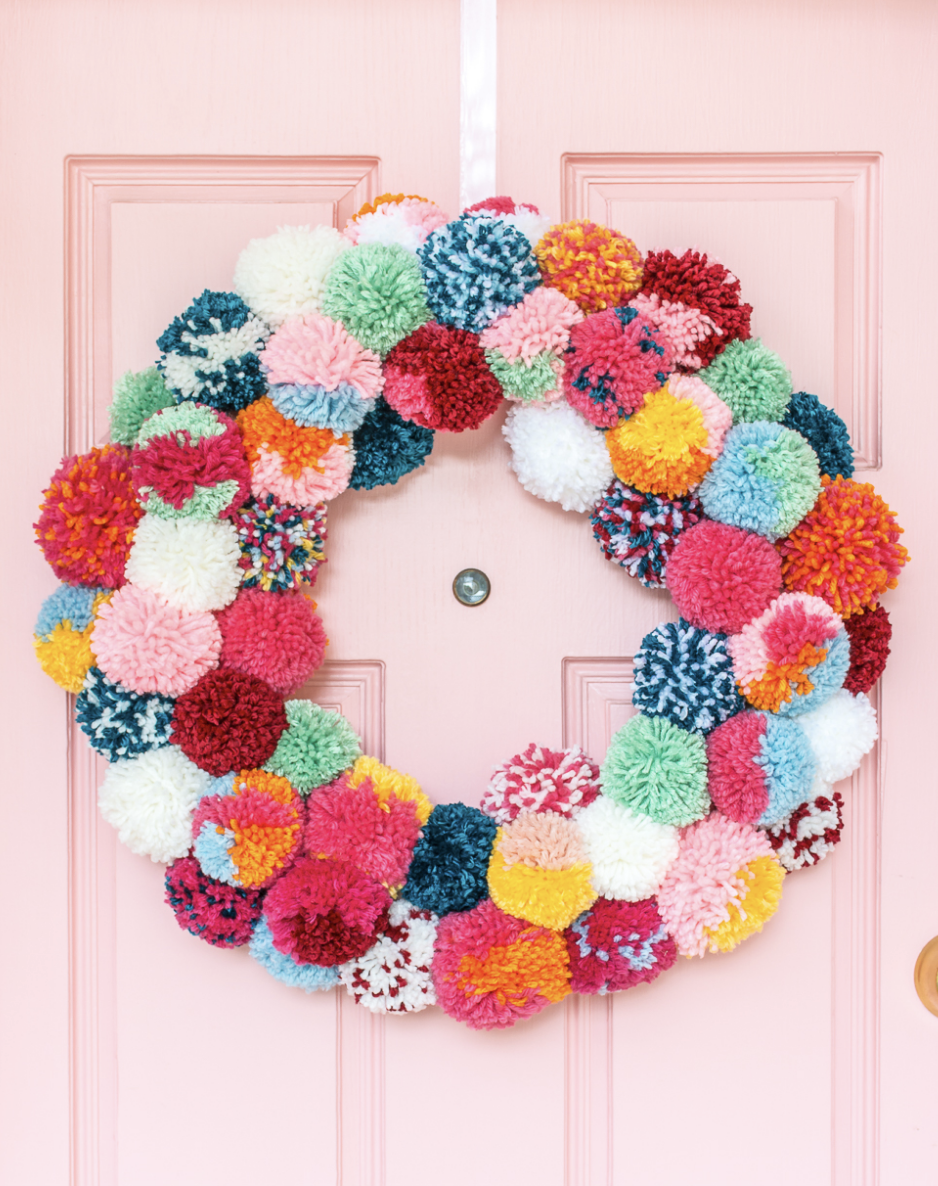 This adorable boho-inspired wreath uses soft, fluffy pom-poms to bring a cozy vibe to your door. It’s playful, unique, and adds the perfect handmade touch to your holiday decor. Try it here.