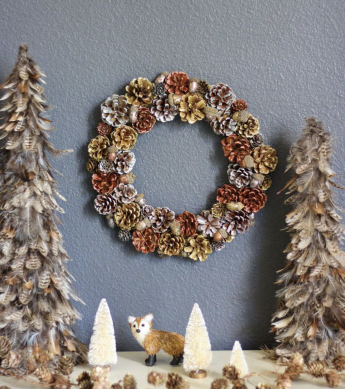 Add a touch of glam to your holiday with this metallic pinecone and acorn wreath! Simple but chic, this wreath mixes natural elements with a metallic finish for extra sparkle. Get the tutorial here.