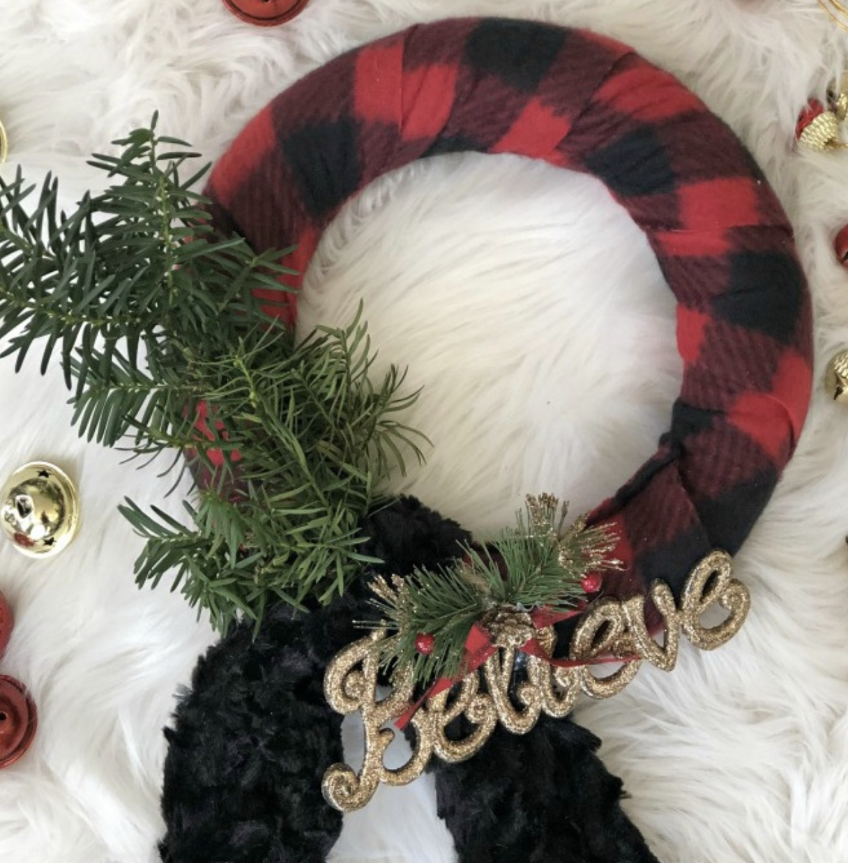 Buffalo plaid never goes out of style, and this Dollar Store scarf wreath is the perfect way to incorporate it into your holiday decor! Cozy and festive, this one is a total classic. Check it out here.