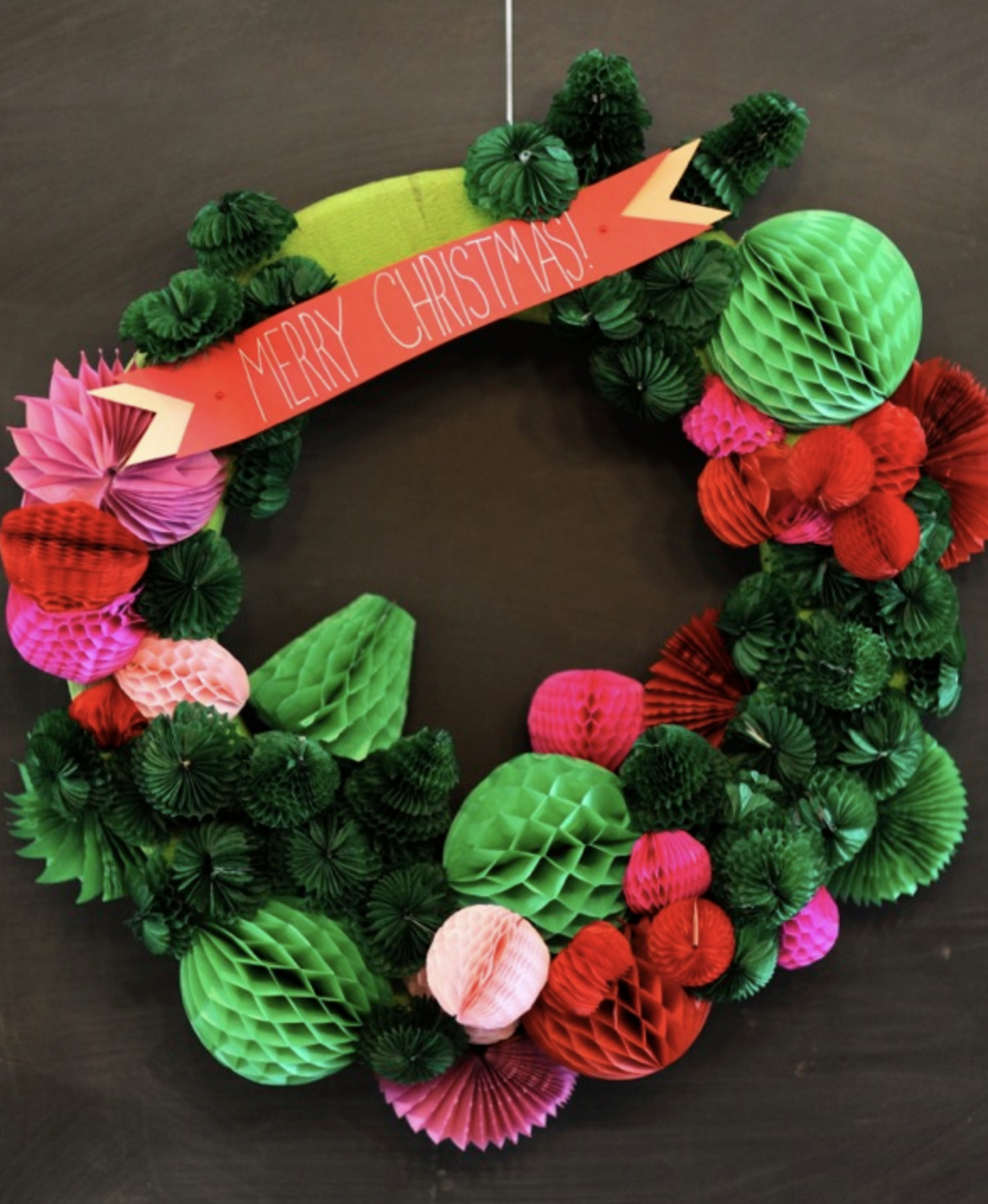 This honeycomb-inspired wreath is both modern and festive, with a textured design that stands out! Perfect for DIYers looking for something different. See the details.