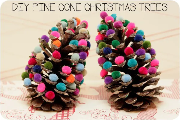Oh these pine cone Christmas trees will look FABULOUS on the mantlepiece. I might try Elmers instead of the hot glue gun though!