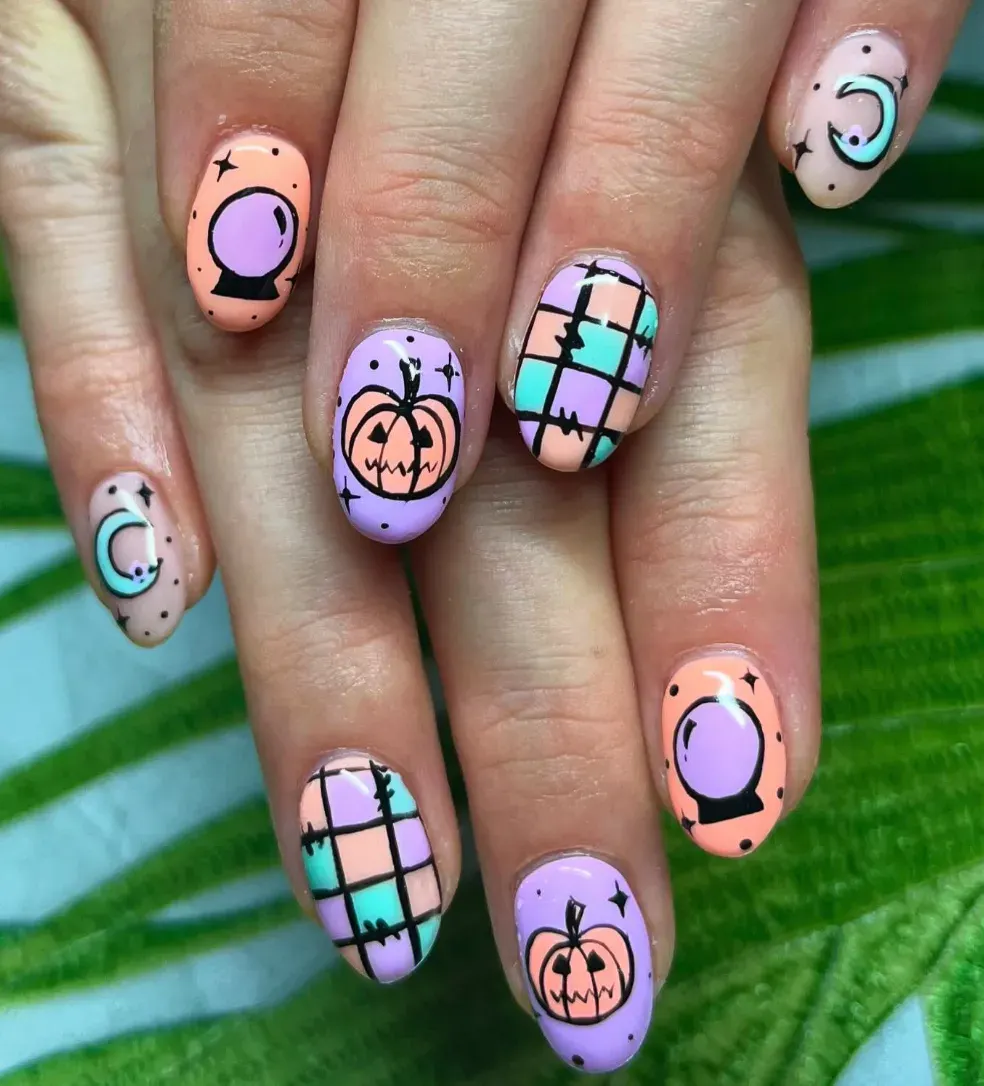 Pastel Pumpkin Vibes – Soft pinks, purples, and mint with pumpkins and moons for cute at home Halloween nails.