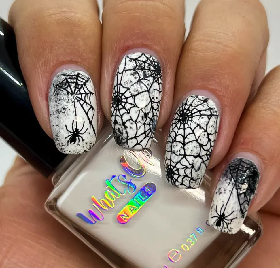 Spiderweb Stamping – Black spiderwebs over white polish give instant DIY spooky nails with zero fuss.