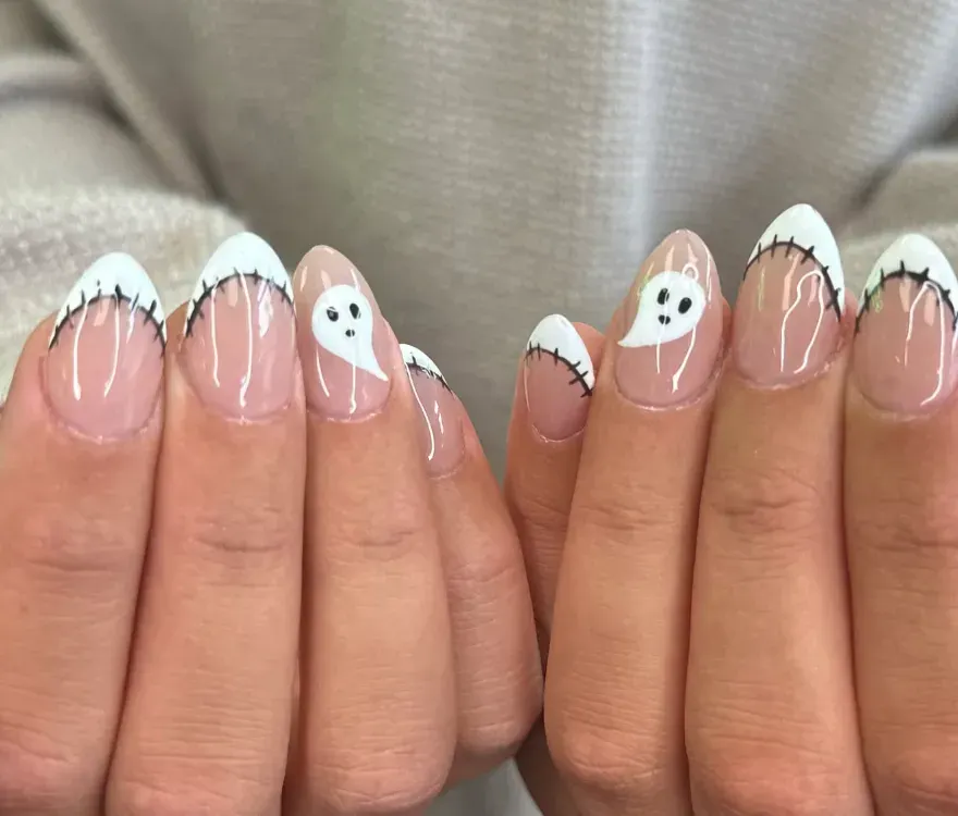 Stitched & Spooky – Ghosts and stitched French tips make these easy October nails a perfect at home Halloween look.