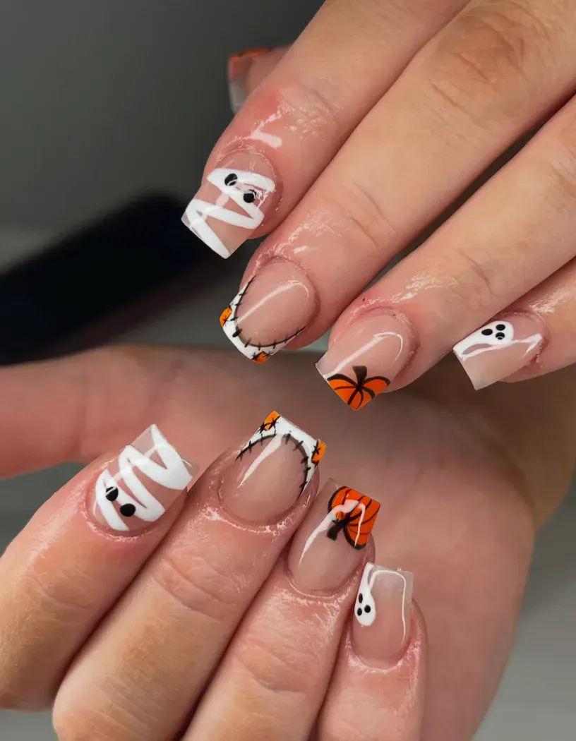 Cute Mummy Tips – Short nails get a spooky-cute twist with easy ghost, pumpkin, and mummy French tips—perfect October nails you can DIY.