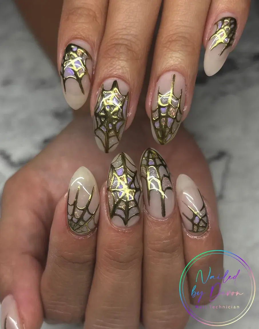 Golden Web Glam – Shimmery spiderweb nails that look luxe but can be recreated with a steady hand and glitter polish.